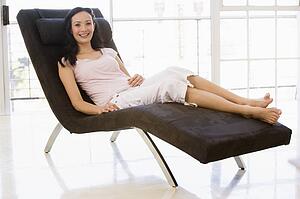 Woman sitting in chair smiling