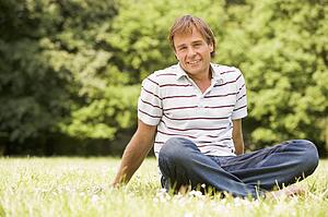 Man sitting outdoors smiling