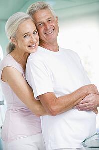 Couple embracing at a spa and smiling