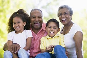 Grandparents laughing with grandchildren.