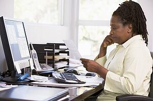 Woman in home office using computer