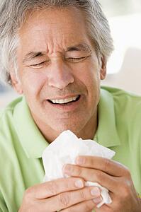 Man Blowing His Nose
