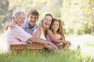 Grandparents having a picnic with grandchildren.