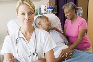 Doctor Standing In Hospital Room With Her Arms Folded