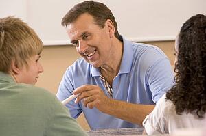 Teacher with two students in classroom