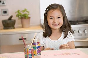 Young Girl Drawing Pictures