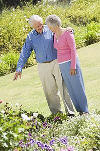 Senior couple in a flower garden