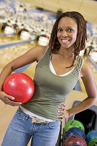 Woman at a bowling lane