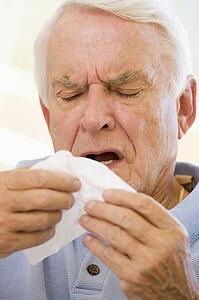 Senior Man Sneezing