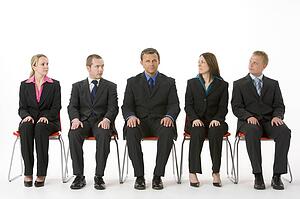 Group Of Business People Sitting In A Line 