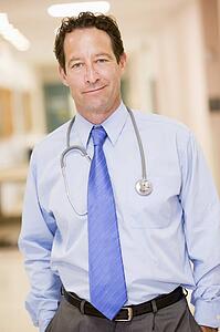 Doctor Standing In A Hospital Corridor