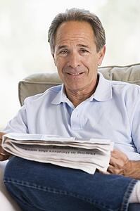 Man relaxing with a newspaper