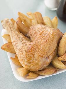 Portion Of Chicken And Chips On A Polystyrene Tray