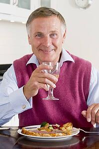 Man Enjoying Healthy meal, mealtime With A Glass Of Wine