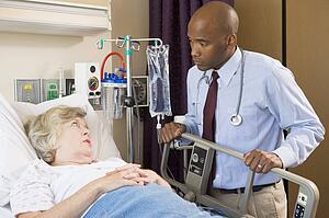 Doctor Checking Up On Patient In Hospital