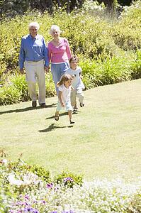 Grandparents walking with grandchildren.