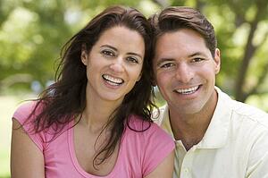 Couple outdoors smiling