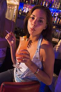 Young woman in a bar smoking