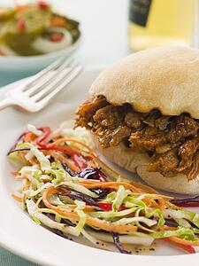 Pulled Pork and Barbeque Sauce Roll with Seeded Slaw and Gherkins