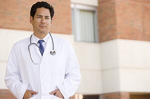 Doctor Standing Outside A Hospital