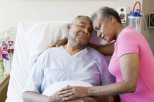 Senior Couple Embracing In Hospital