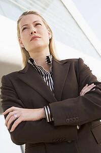 Businesswoman standing outdoors by building