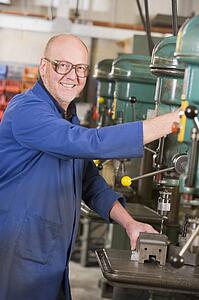 Machinist working on machine