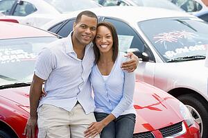 Young couple shopping for a new car