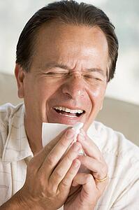 Man Blowing His Nose
