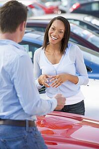 Woman shopping for a new car