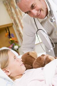 Doctor Checking Up On His Young Patient
