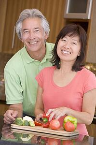 Husband And Wife Preparing meal, mealtime Together