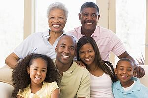 Extended family sitting on sofa