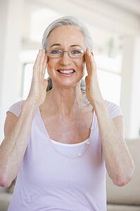 Woman Looking Through New Glasses