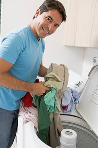 Man Loading Washing Machine