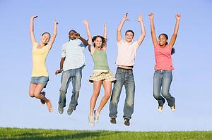 Portrait Of A Group Of Teenagers Jumping 