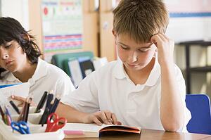 Students in class reading books