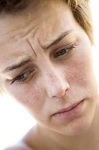Head shot of sad woman