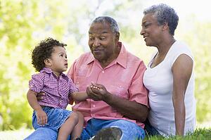 Grandparents with grandson in park
