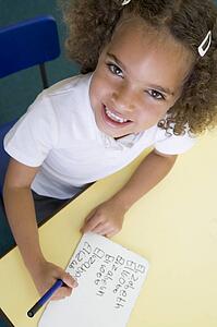 Student in class learning spelling (selective focus)