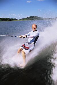 Man waterskiing barefoot