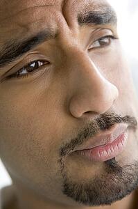 Head shot of man scowling