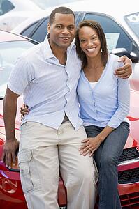 Young couple shopping for a new car
