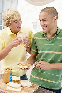 Teenage Boys Making Sandwiches 