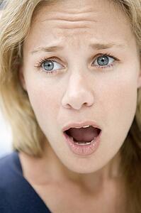 Head shot of surprised woman