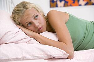 Teenage Girl Lying On Her Bed 