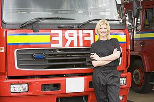 Firewoman standing in front of fire engine