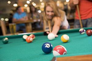 Woman playing pool