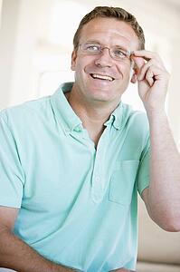 Man Looking Through New Glasses