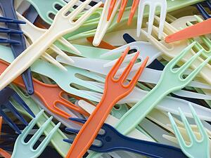 Pile Of Coloured Plastic Take Away Forks